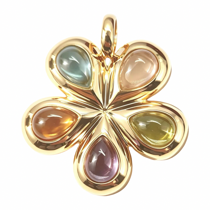 A gold four-petal flower pendant featuring smooth, teardrop-shaped multicolor gemstones in each petal, set against a plain white background.