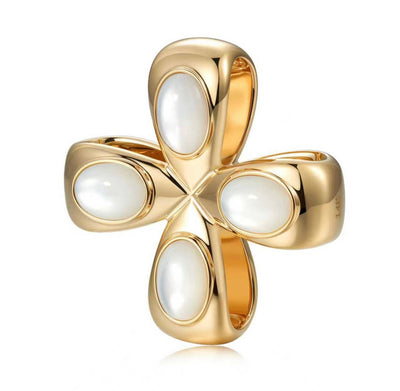 Mother of Pearl Cabochon clover / cross/ charm/ set in 14K yellow gold. Made in Palm Beach Florida by jewelry design team Pelimingo. Small local business. Fine Jewlery. Worn on necklace or collar