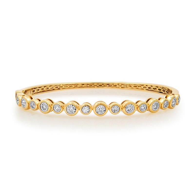 14K yellow gold high polished diamond bangle bezel set.  Great to wear alone or add to your wrist stack.  Sold in Palm Beach by local jewelry design team Pelimingo Palm Beach