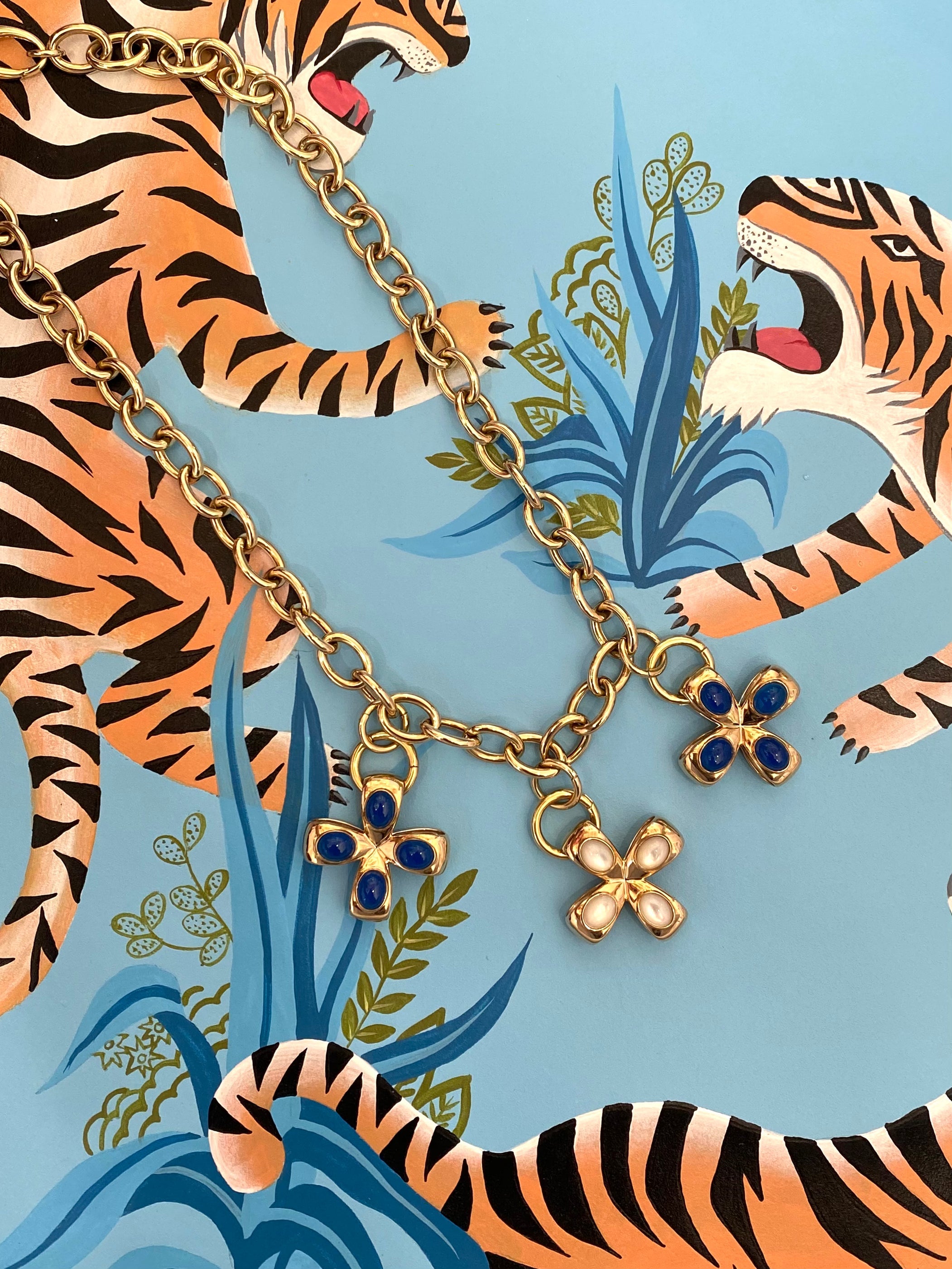 Gold necklace with cross pendants or charms in 14K or 18K yellow gold.  Made in Palm Beach by local jewelry designers Pelimingo Palm Beach.
