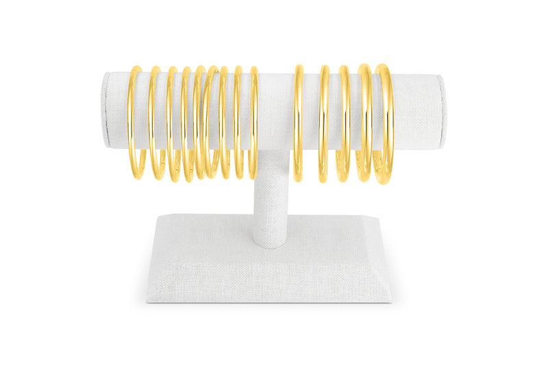 14K and 18K Gold Bangles in oval shape.  With double locking and clasp.  The Perfect Bangle.  Palm Beach Designed by local jewlery design team Pelimingo.  High polished stackable bangles.