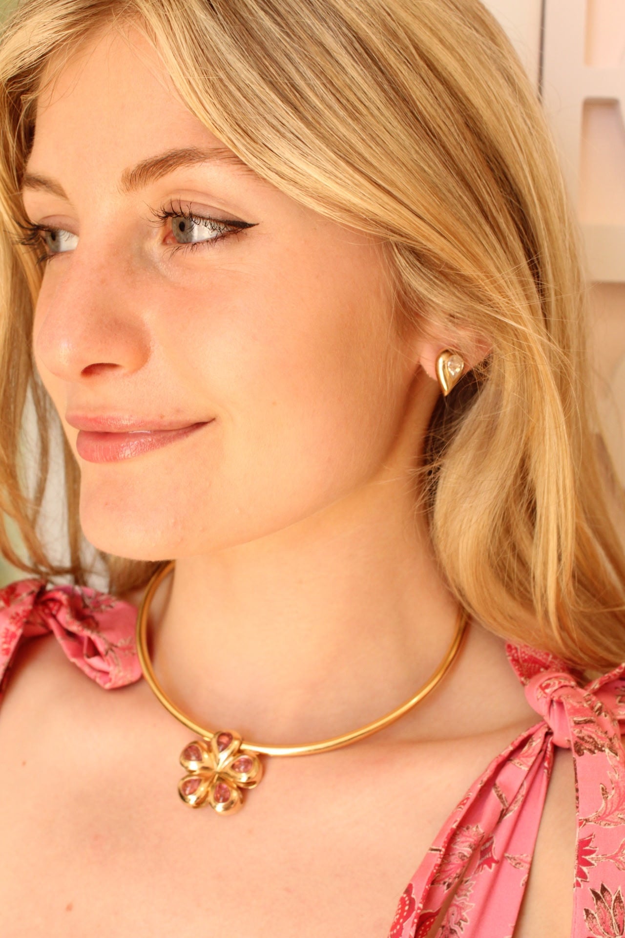 Flora Blossom flower in 14K Yellow Gold with Pink Cabochon Tourmaline Stones.  Made in Palm Beach by local design team and jewlery store Pelimingo Palm Beach