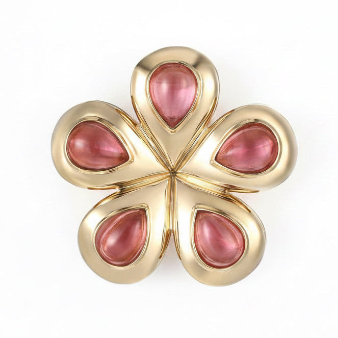 Flora Blossom flower in 14K Yellow Gold with Pink Cabochon Tourmaline Stones.  Made in Palm Beach by local design team and jewlery store Pelimingo Palm Beach