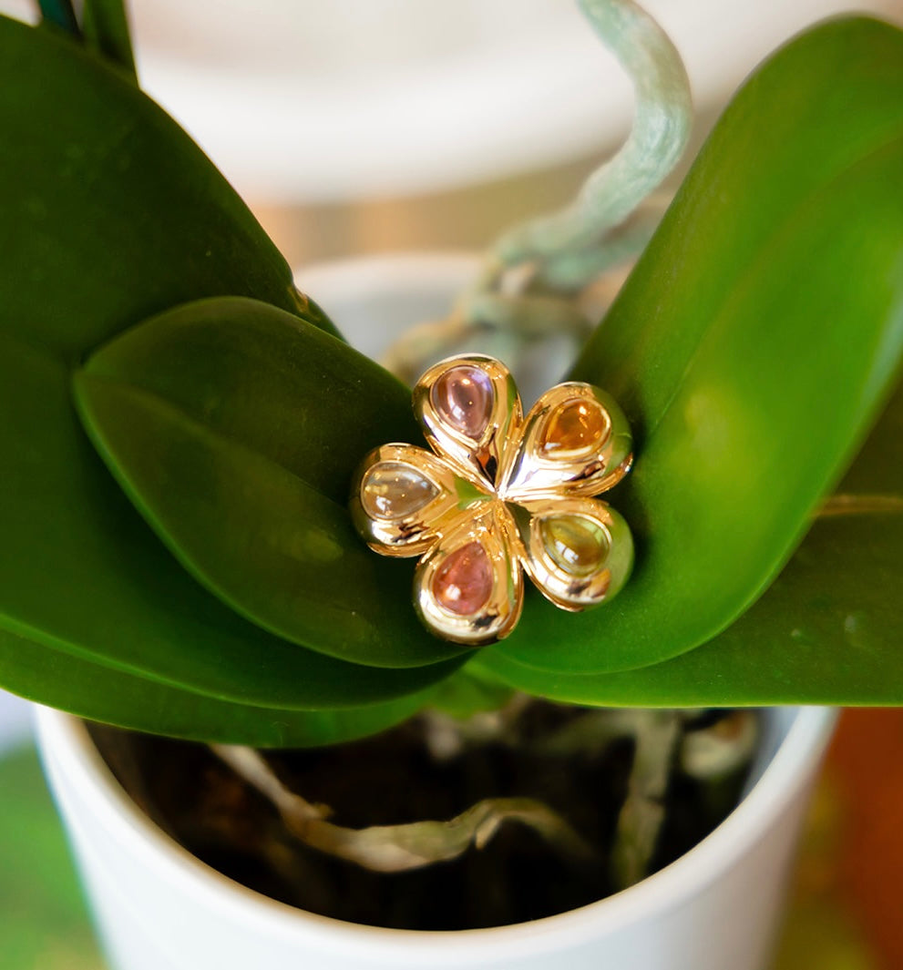 Our Flower Multi Cabochon glider to put on a necklace or collar.  14K yellow gold with peridot, citrine, pink tourmaline, blue topaz, all made locally in Palm Beach Florida by jewelry design team Pelimingo Palm Beach