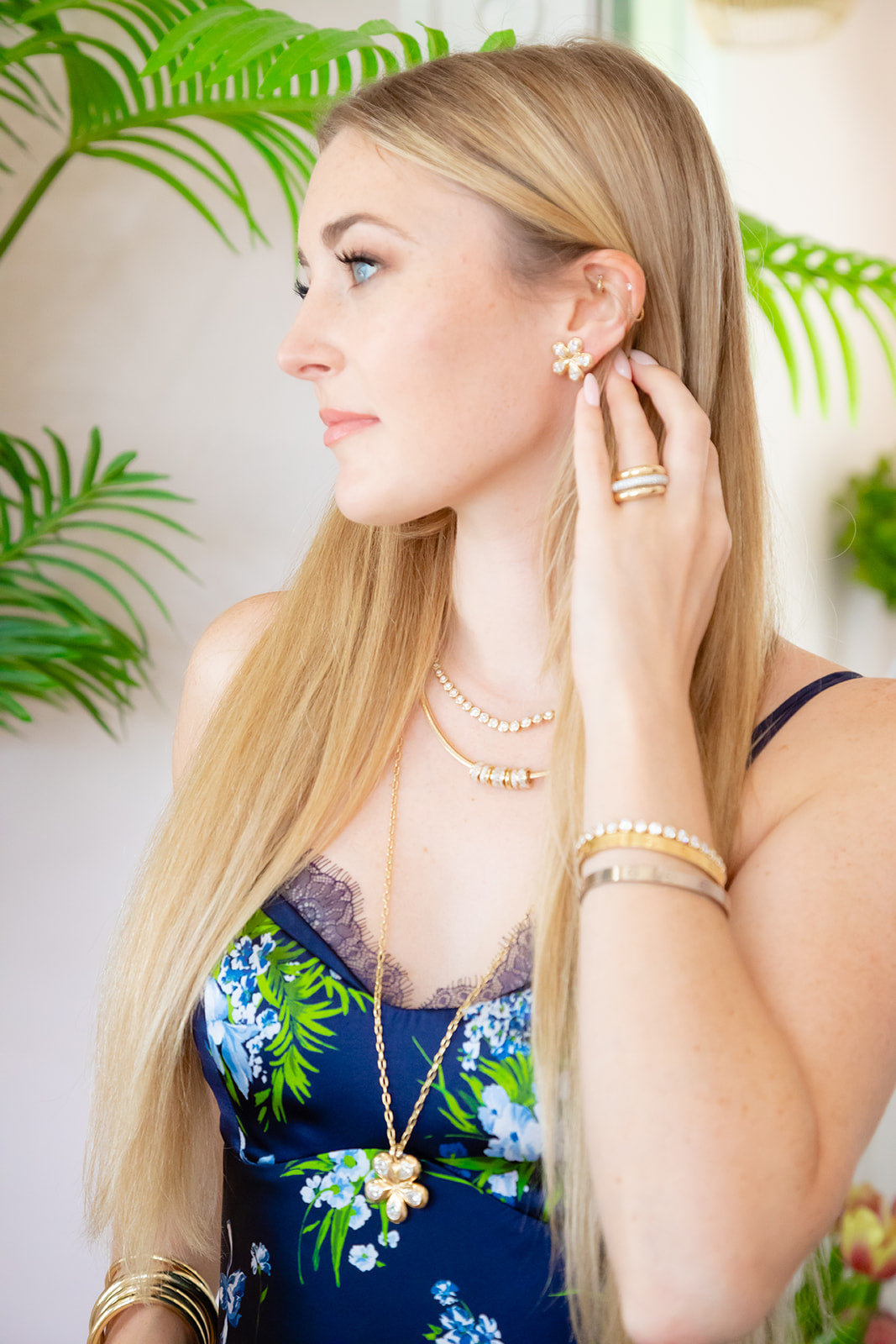 Pair of gold flower-shaped earrings with lab diamonds set in 14K yellow gold.  Designed by Palm Beach jewelers Pelimingo Palm Beach.  Palm Beach style, flower blossom, fine jewlery