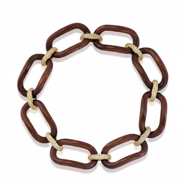 A wooden link chain necklace with dark brown wooden oval links connected by pave.