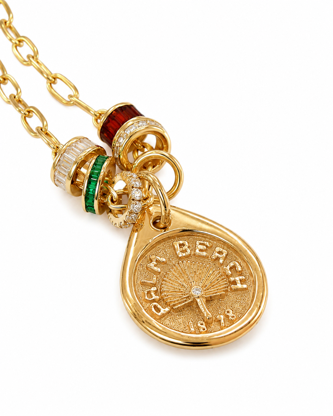 Our Palm Beach Pendant / Charm is made in 14K solid yellow gold with a satin and polished finish. Handcrafted in Palm Beach Florida by jewelry design team and local fine jewelry Pelimingo.  Palm Beach town name, date town was settled and native palm tree Sable Palm on charm.