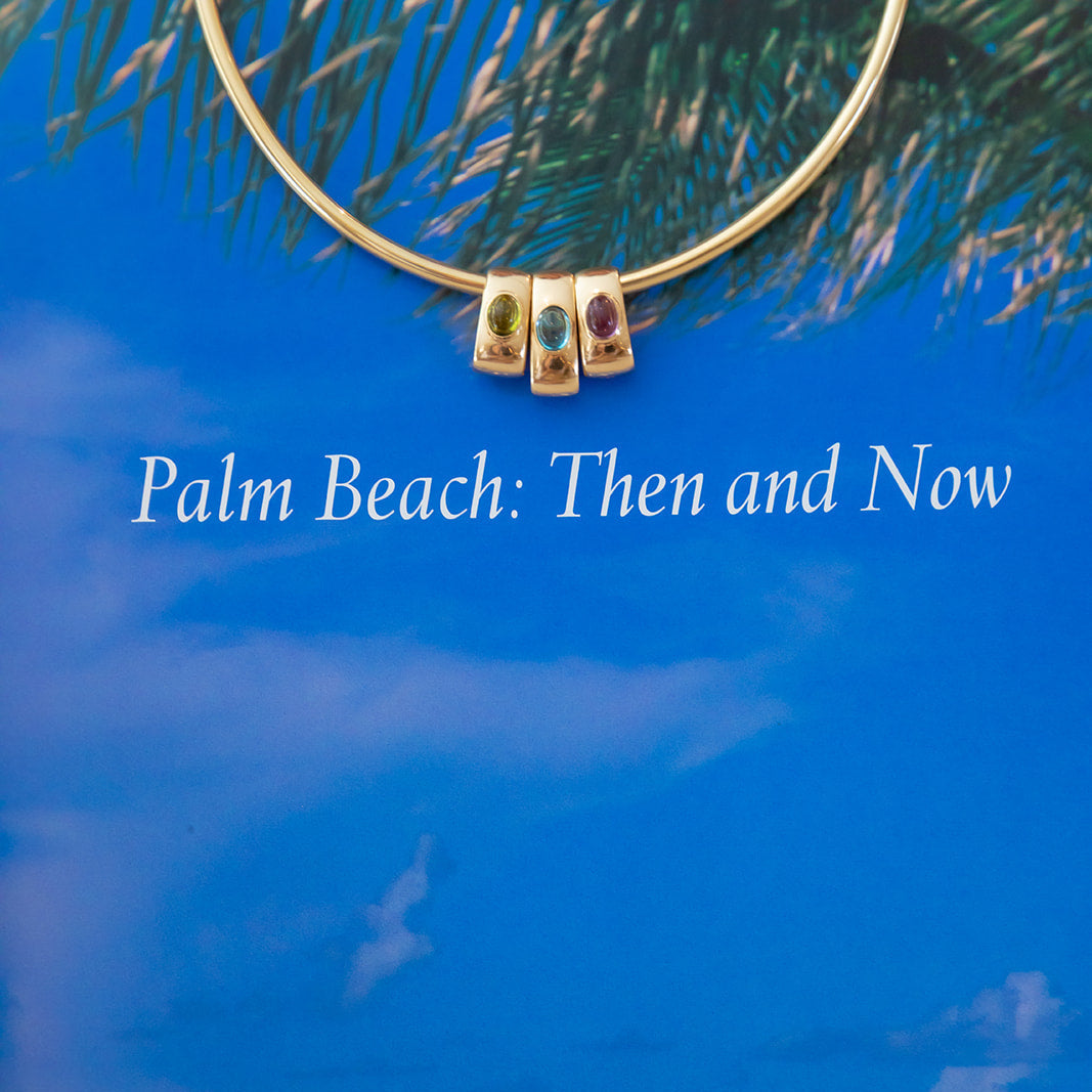 18K yellow gold glider / pendant/ charm/ in light blue topaz cabochon bezel set designed by Palm Beach jewelry designers Pelimingo Palm Beach local jewelry business women owned