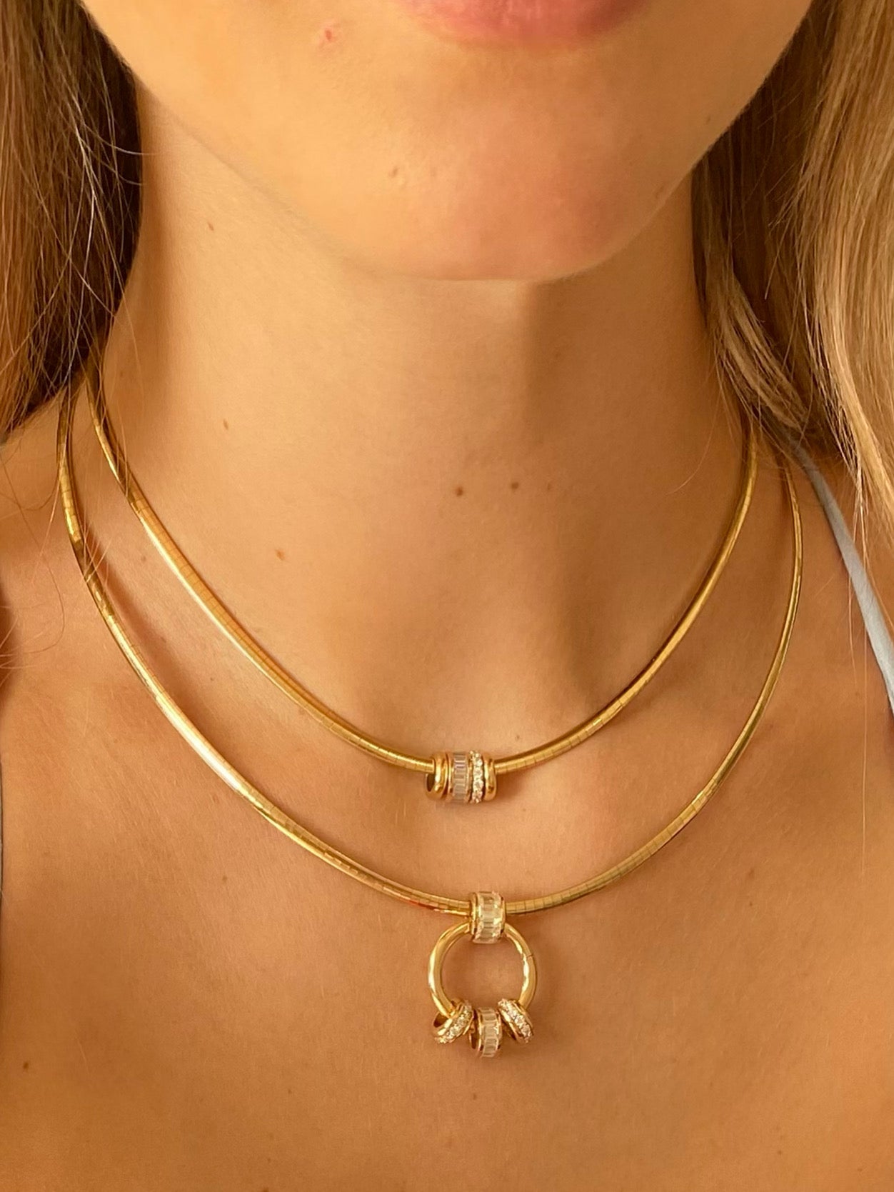 Two Palm Beach Collars in 14K yellow gold omegas with the addition of our XL Peggy Jump ring and Rondelles and Spacers.  Made in Palm Beach by local jewelry design team Pelimingo Palm Beach