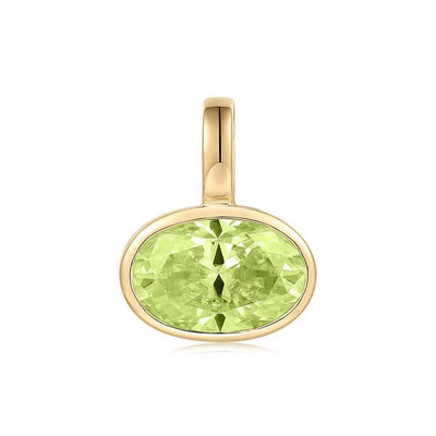 Gold pendant with a green gemstone on a white background, light green peridot set in 14K yellow gold.  Made by design team in Palm Beach, Florida Pelimingo Palm Beach.  Worn on necklace or collar