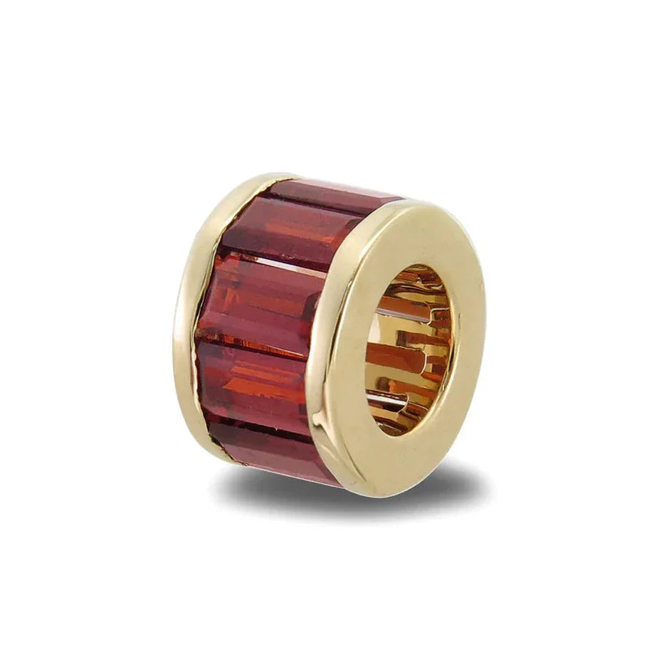 Red garnet rondelle set in 14K yellow gold.  Worn on necklace, bangles, chains and collars.  Palm Beach Designed Pelimingo Fine Jewlery.