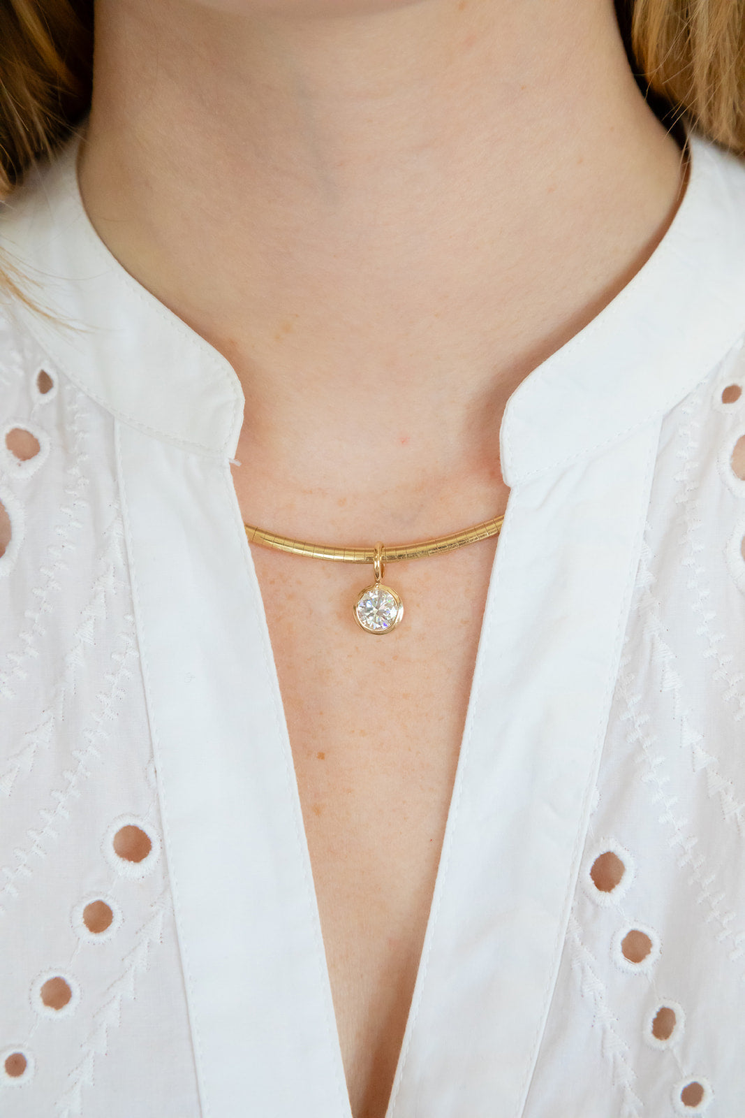 14k yellow gold solitaire diamond pendant bezel set.  Worn on a necklace, collar or chain.  Designed by jewelry team Pelimingo Palm Beach.  Fine Jewlery, Palm Beach Style, lab grown stone