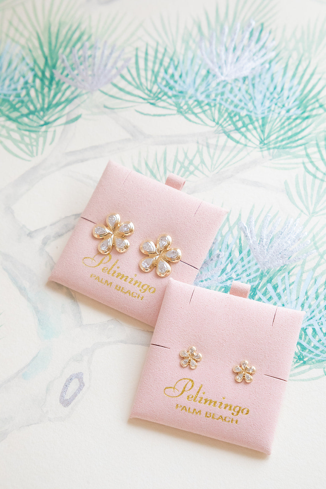 Pair of gold flower-shaped earrings with lab diamonds set in 14K yellow gold.  Designed by Palm Beach jewelers Pelimingo Palm Beach.  Palm Beach style, flower blossom, fine jewlery