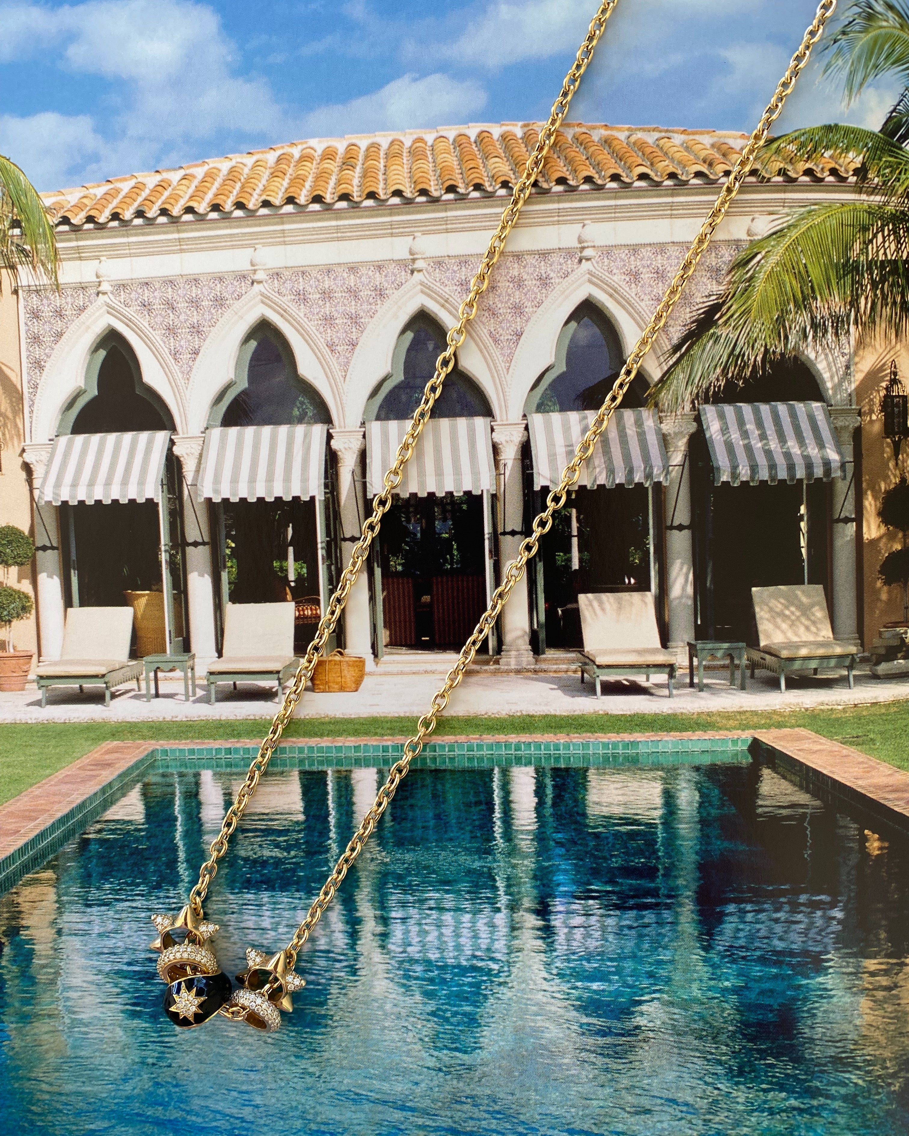 Swing over a pool with a building and palm trees in the background in Palm Beach and check out Pelimingo's spiked spacers